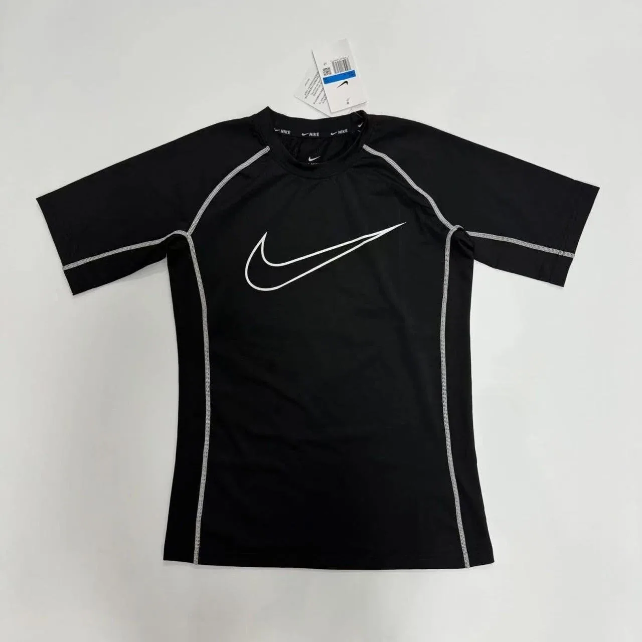 Not a Stone Island T-shirt but rather a women athletic/fitness short-sleeve top from Nike