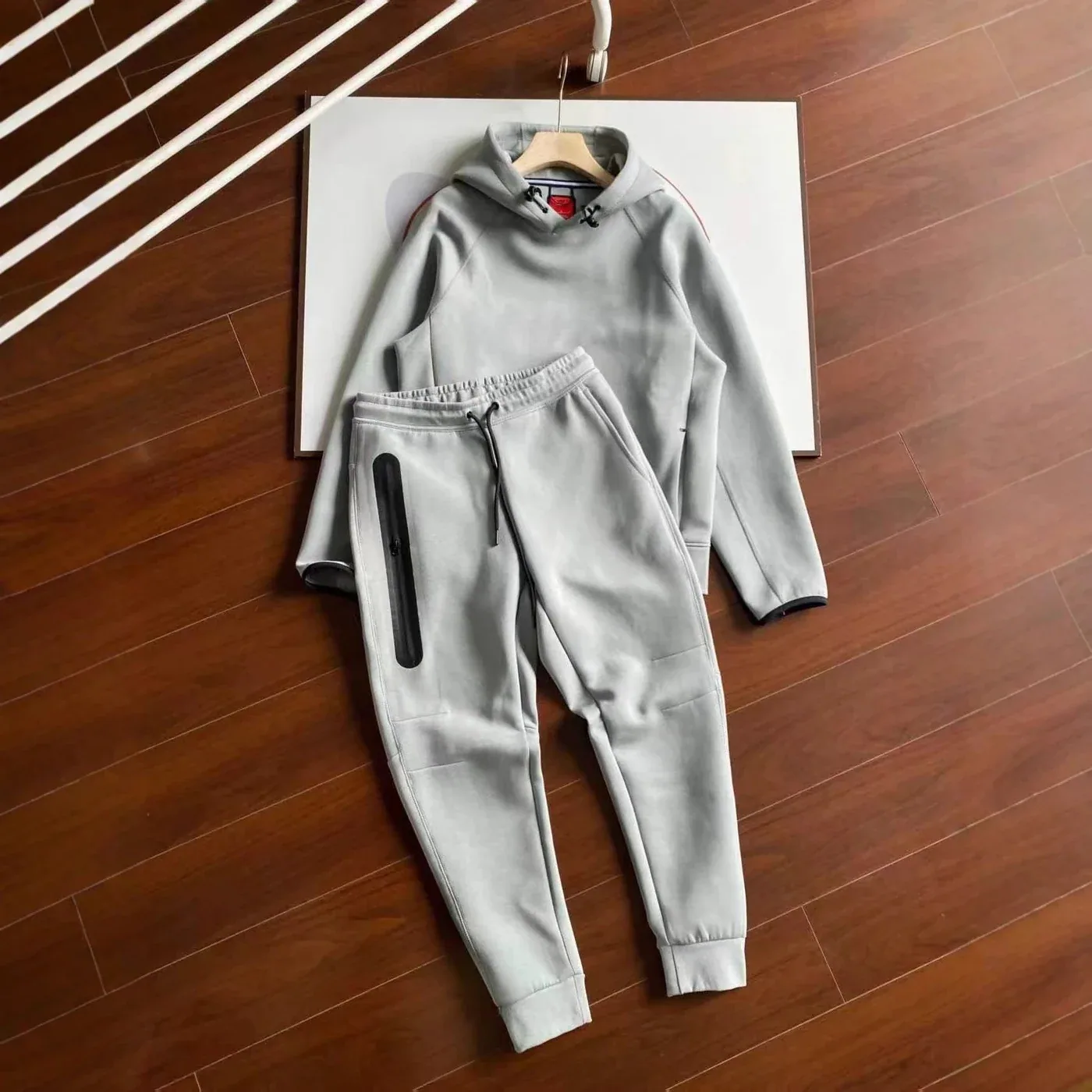 A grey tracksuit from the Nike Tech Fleece