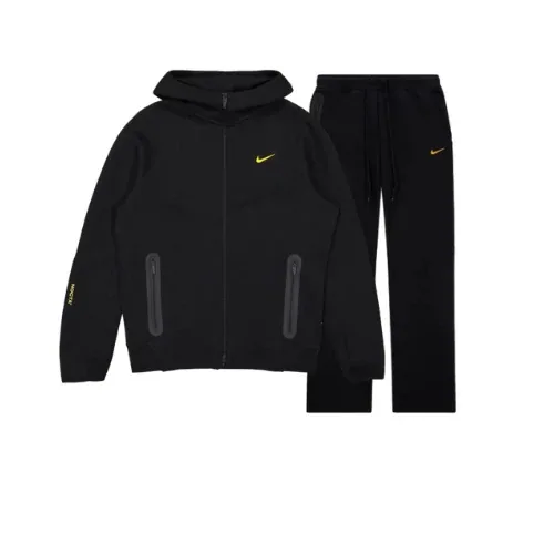 A black and gold tracksuit from the Nike Tech Fleece