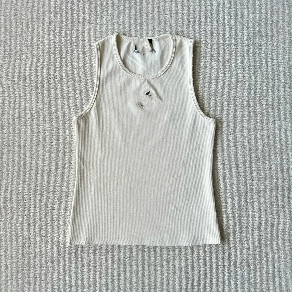Off-White Ribbed Tank Top with a Distressed Worn-In Look