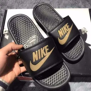 Nike Black and Gold Slide Sandals