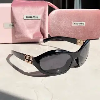 Miu Miu black frame oval vintage sunglasses